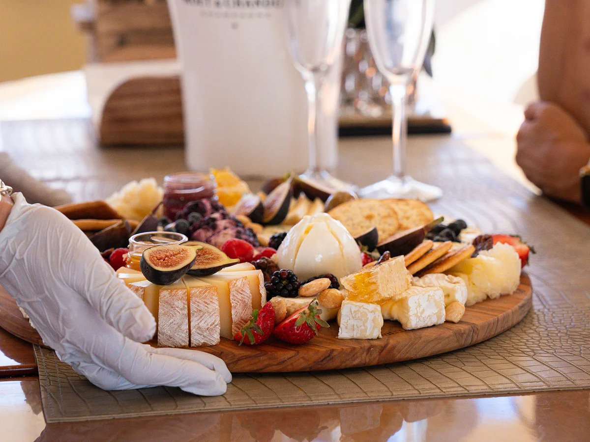 Gourmet charcuterie board with champagne on yacht deck