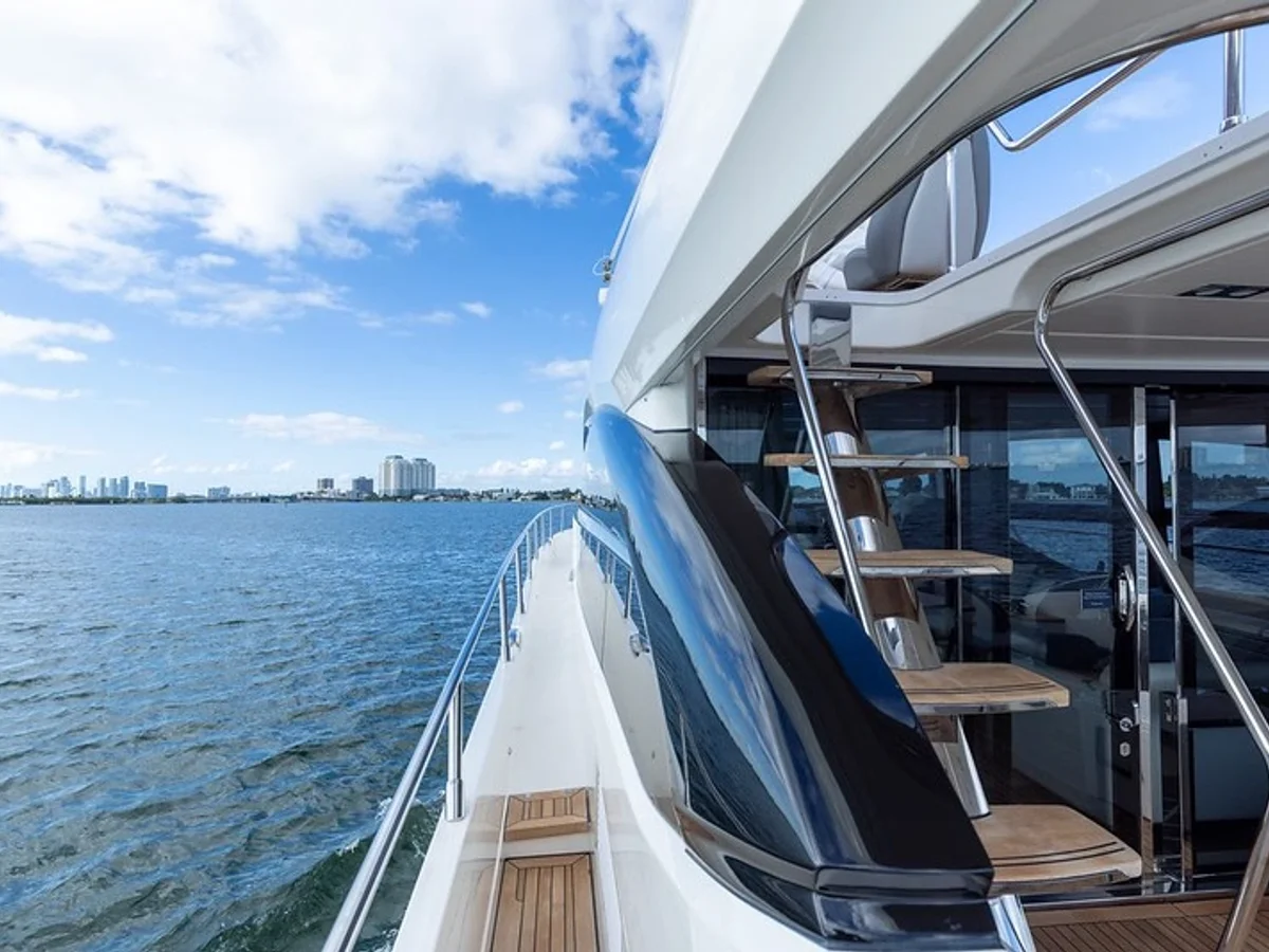 Princess 74 yacht cruising calm waters off Miami at sunset
