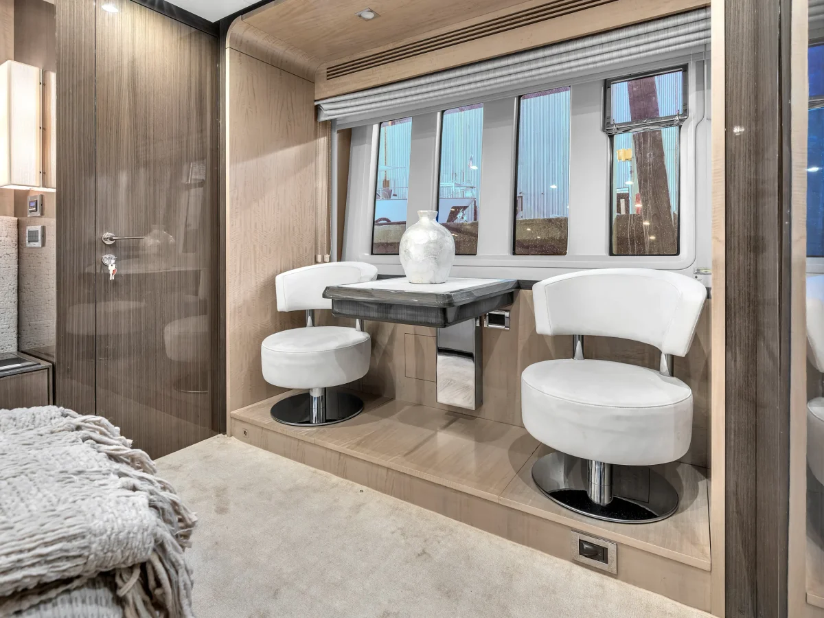 Warm salon interior aboard the Azimut 88, the shaded retreat on a full-day Miami World Cup charter