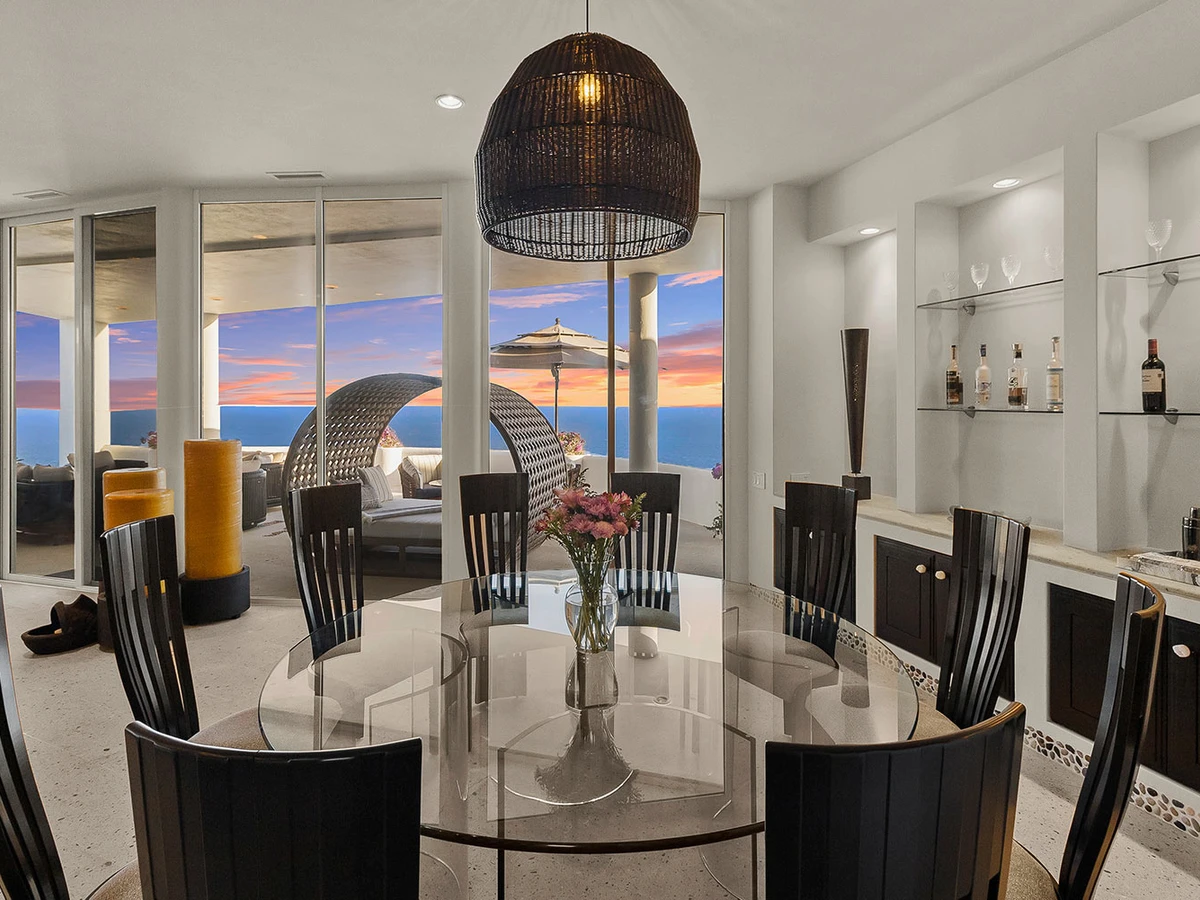 Cliffside pool and lounge terrace above the Pacific in Cabo