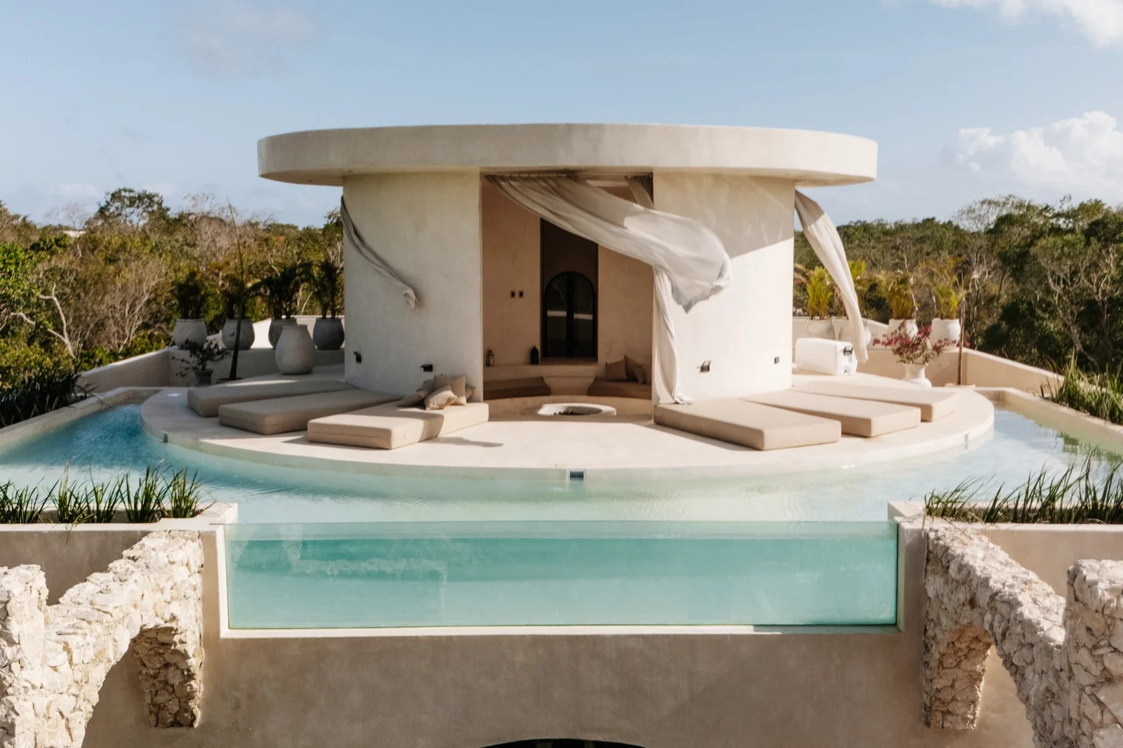 Rooftop and pool at a Tulum jungle villa at dusk