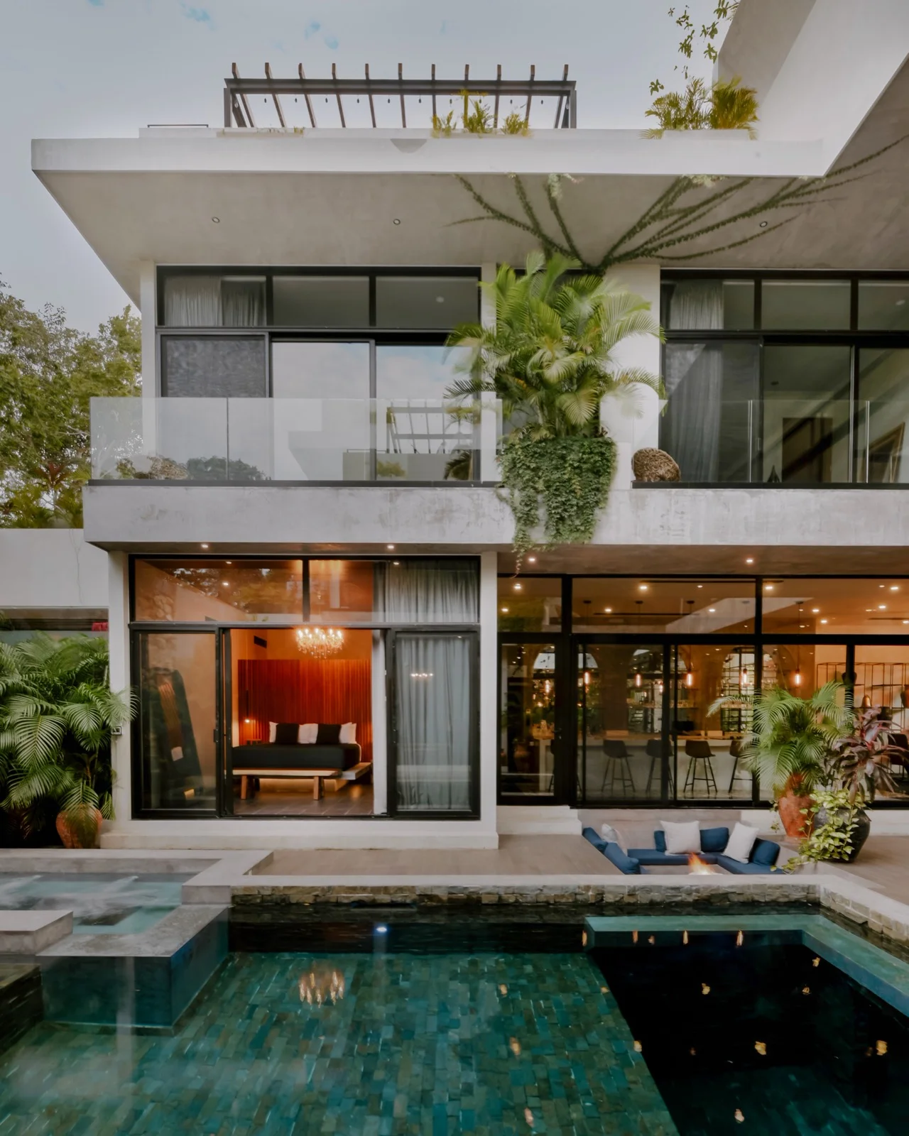 Outdoor kitchen and long dining table at a large Tulum estate