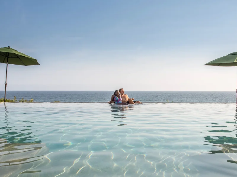 Private beachfront villa at Puerto Escondido with a rooftop pool overlooking the Pacific at sunset