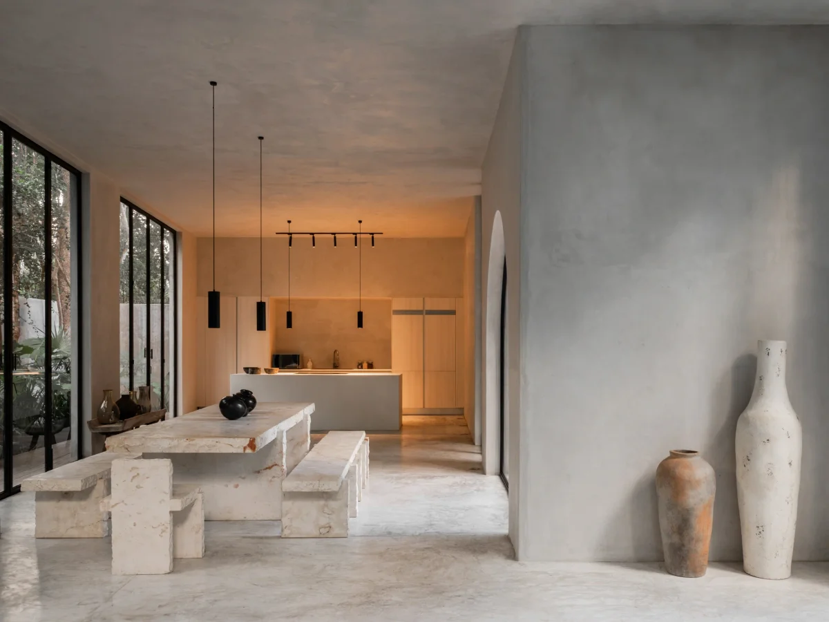 Plunge pool and shaded terrace surrounded by jungle in Tulum