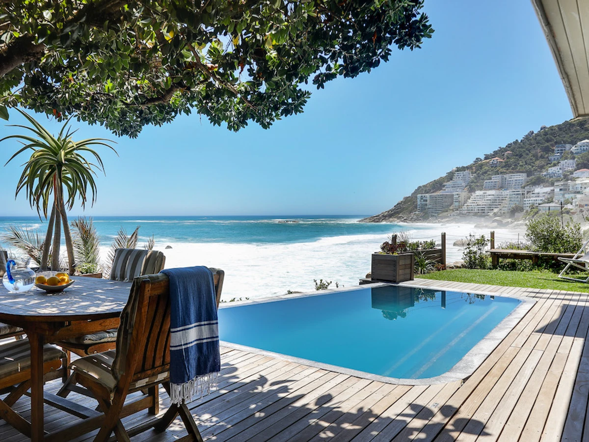 A villa infinity pool in Clifton facing west over the Atlantic toward the sunset