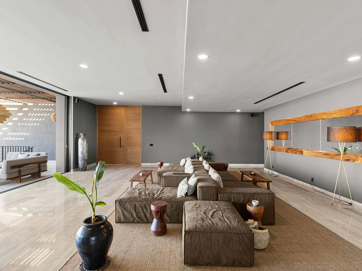 Open plan living and dining space arranged for a large group