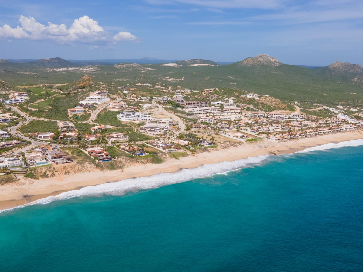 Nine-bedroom beachfront estate at Puerto Los Cabos with a wide pool deck and the Sea of Cortez behind