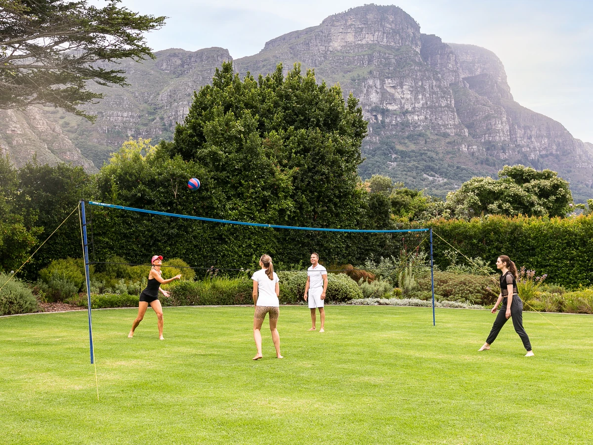 A group playing garden games on the lawn of a Constantia villa
