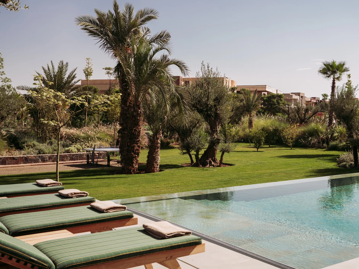 Heated swimming pool and covered dining pergola at Villa 178, Amelkis Golf Resort, Marrakech