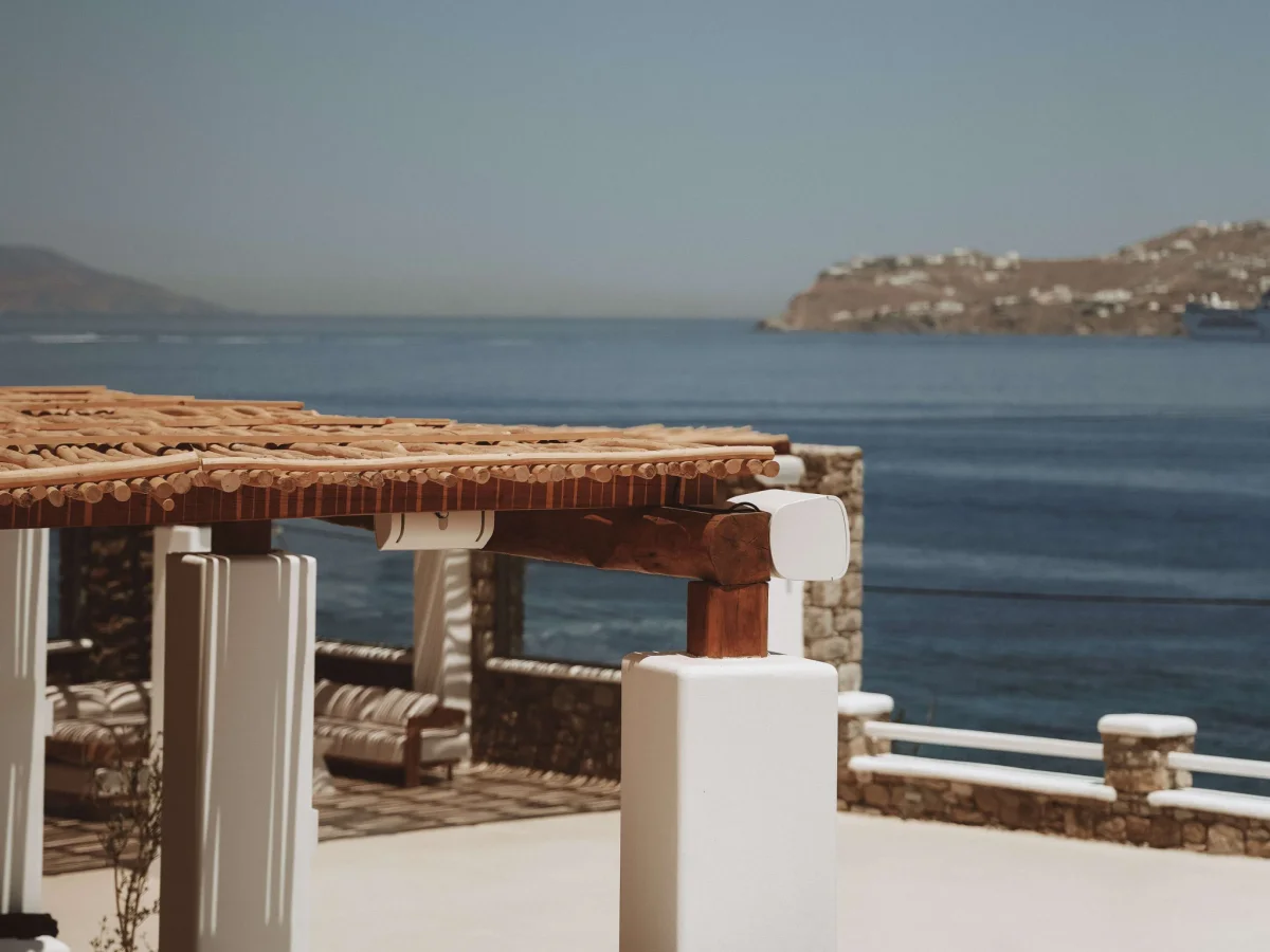 Sun loungers and a pool terrace overlooking the sea in Mykonos