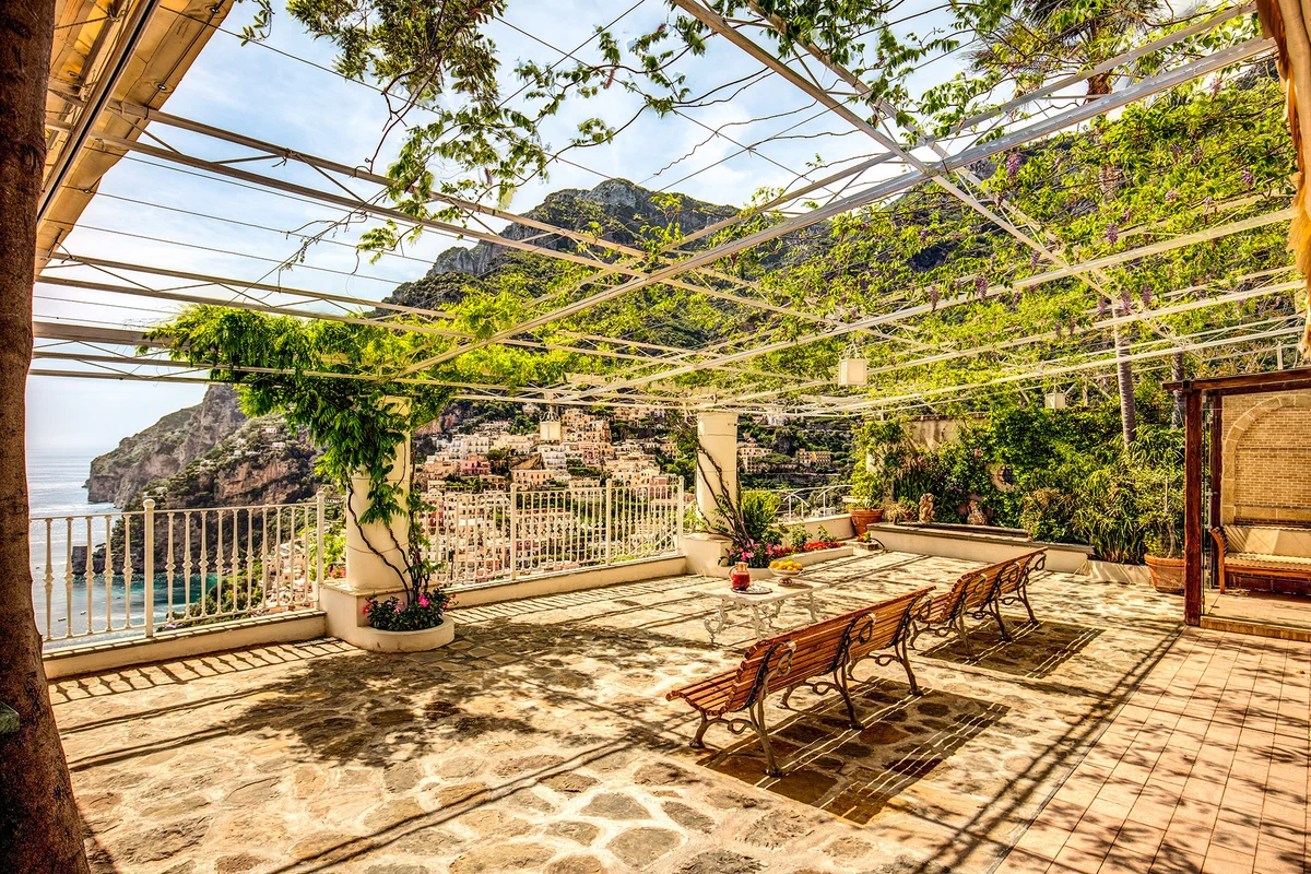 Cliffside terrace above the sea on the Amalfi Coast at golden hour