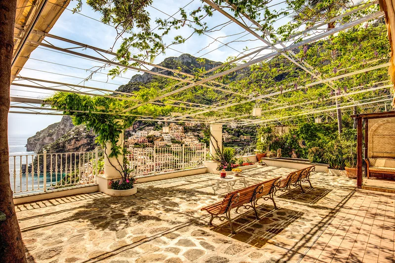Cliffside terrace above the sea on the Amalfi Coast at golden hour