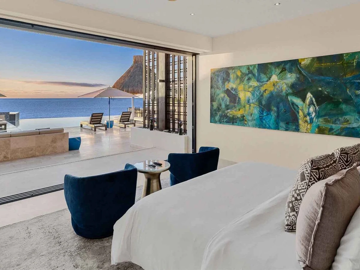 Desert villa terrace with sea view and loungers in Cabo