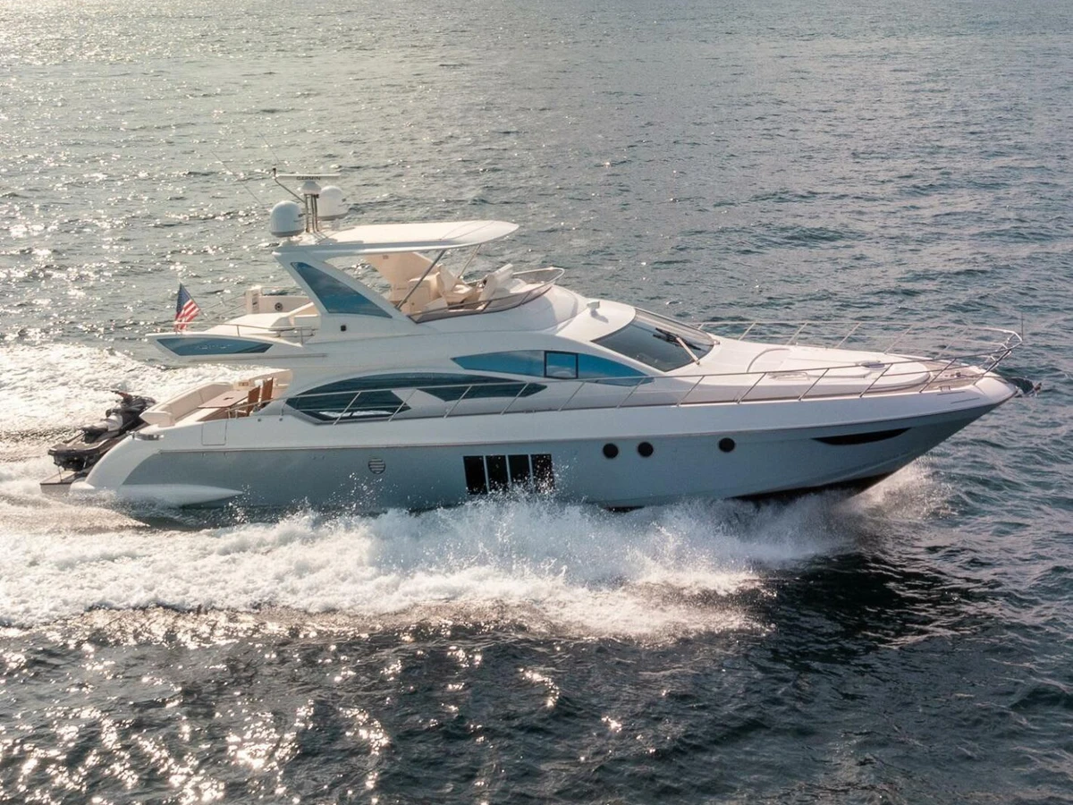 Azimut 66 motor yacht cruising turquoise waters off Miami