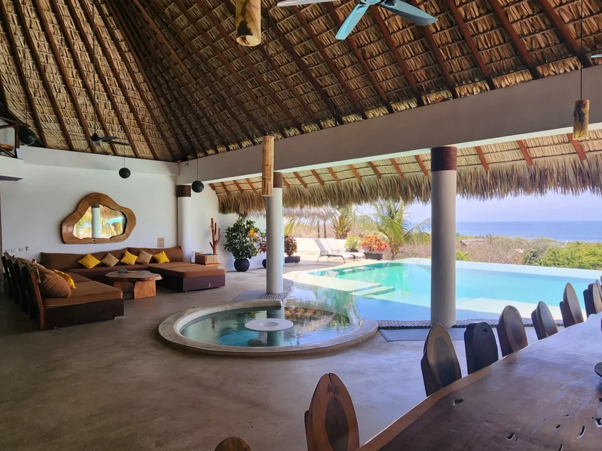 Open palapa living pavilion and infinity pool above the Pacific in Puerto Escondido