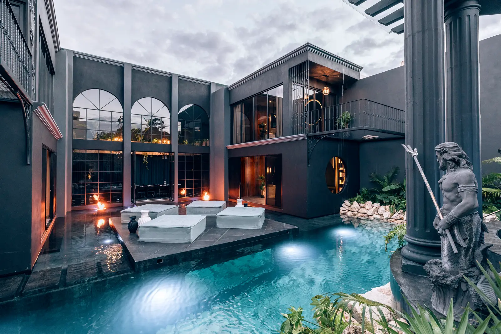 Luxury villa with pool in Tulum jungle at golden hour