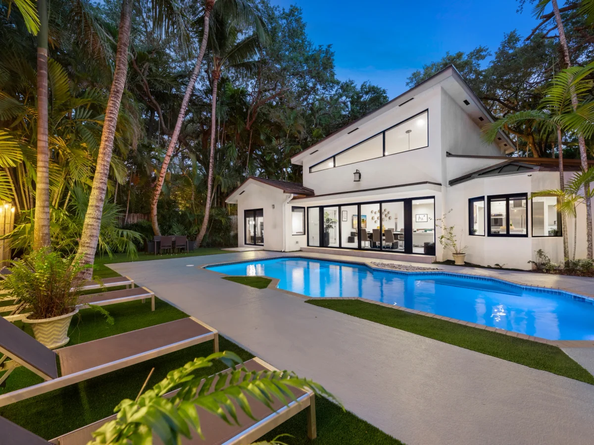 Waterfront villa pool deck at dusk in Miami